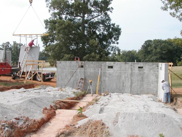 Bailey site storage building — solid precast wall panels with plank roof