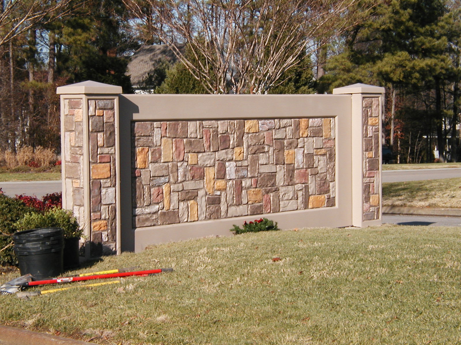 Birkdale community — cantilever precast retaining wall between amenity center and lot pads